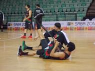 An Afghanistan player stretching his hamstrings before the match against Nepal. Afghanistan went on to secure a facile 78-20 win. Copyright: Gopalakrishnan R